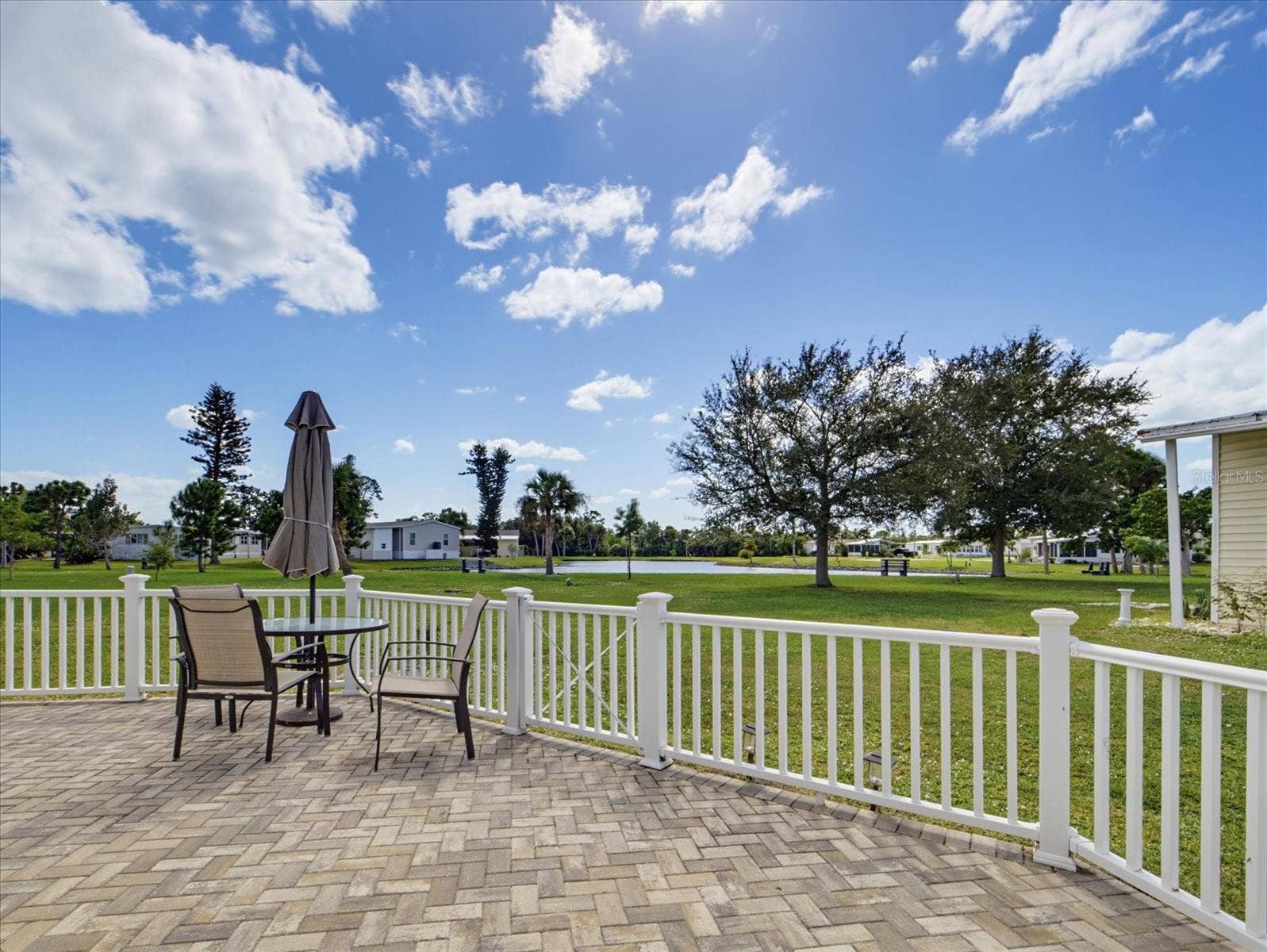 THIS PAVED PATIO IS FULLY FENCED.
