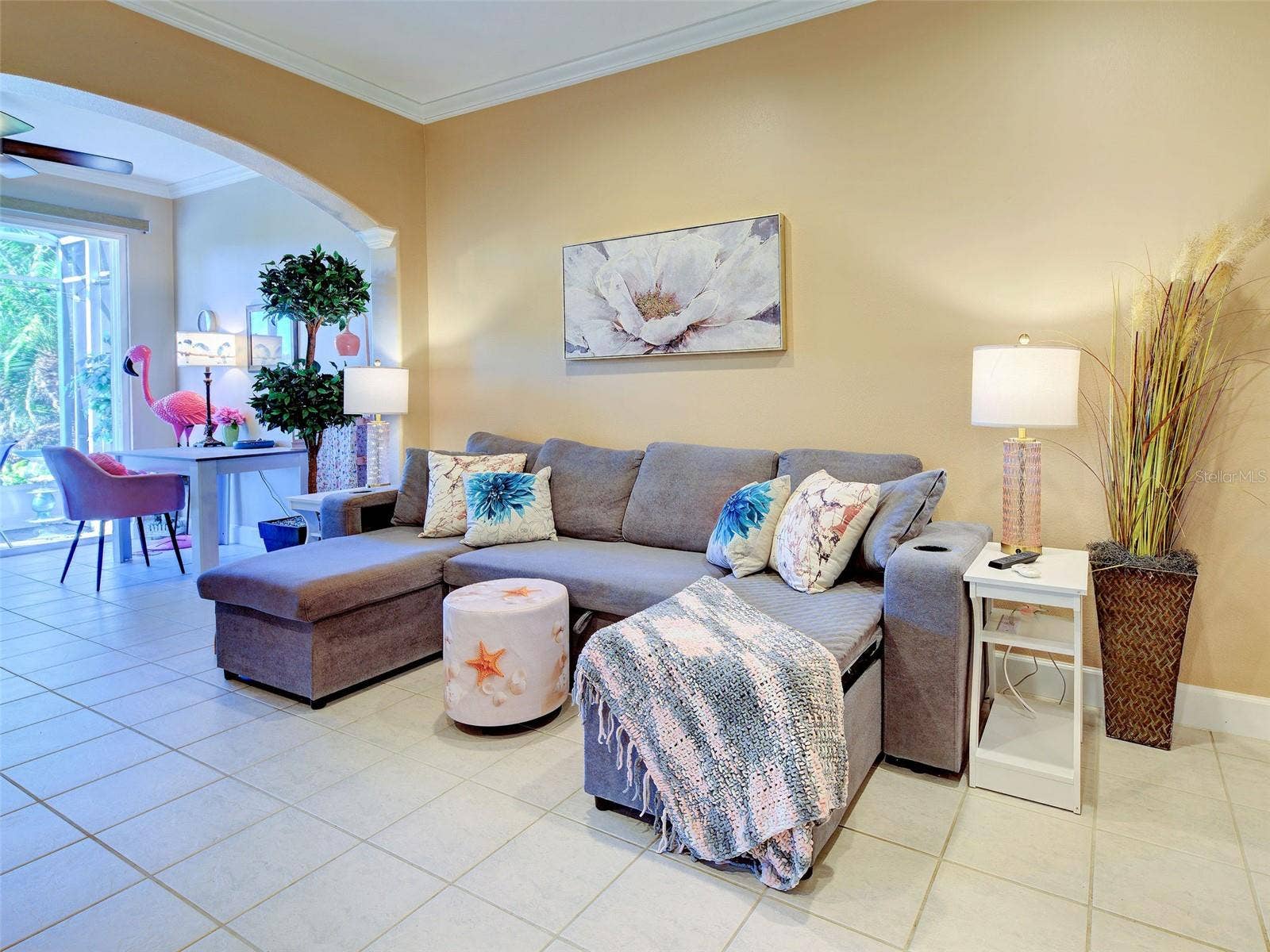 Living Room with extension and attached screened lanai with preserve view.