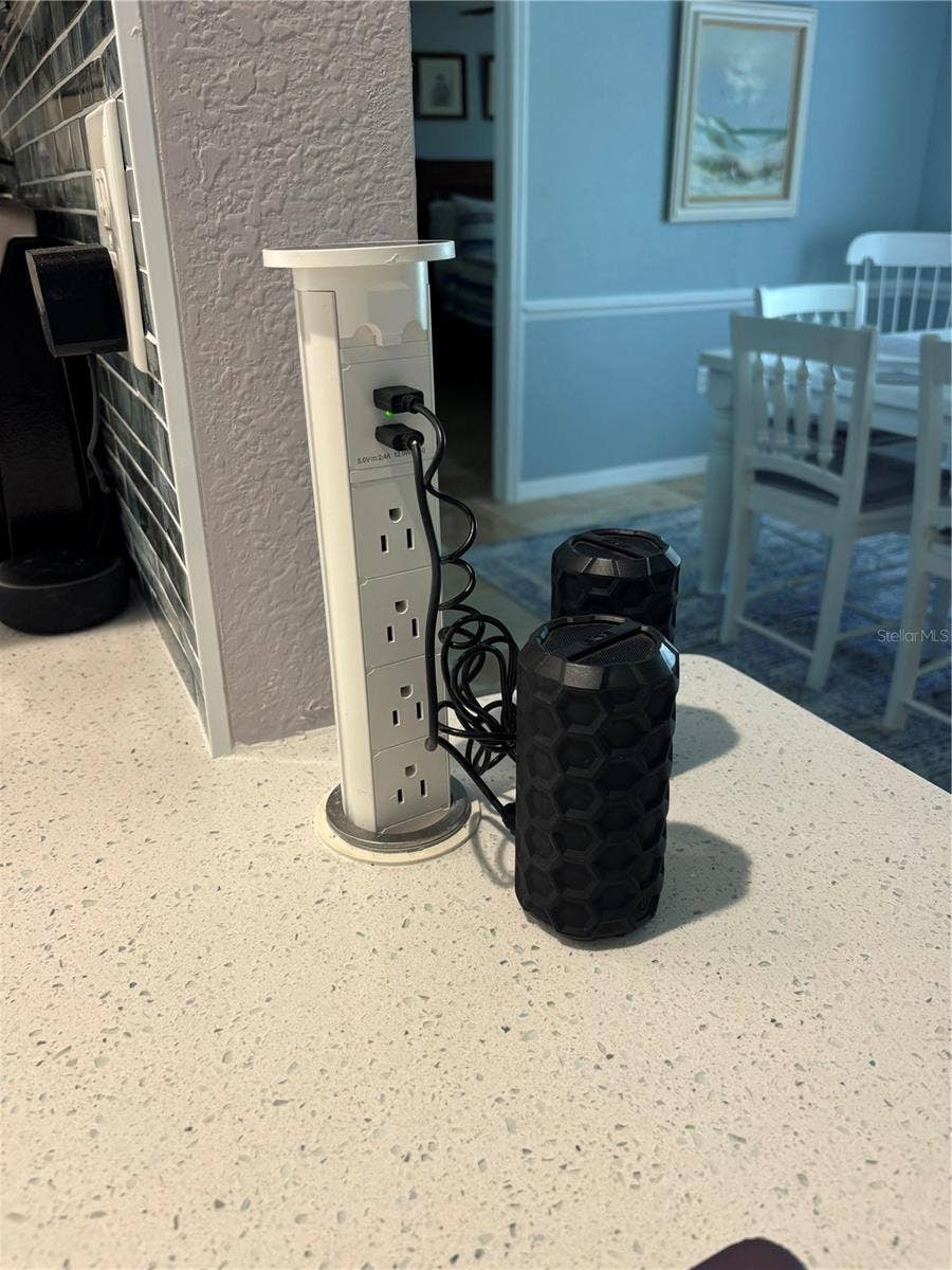 Pop up power bar and charger in kitchen counter folds away