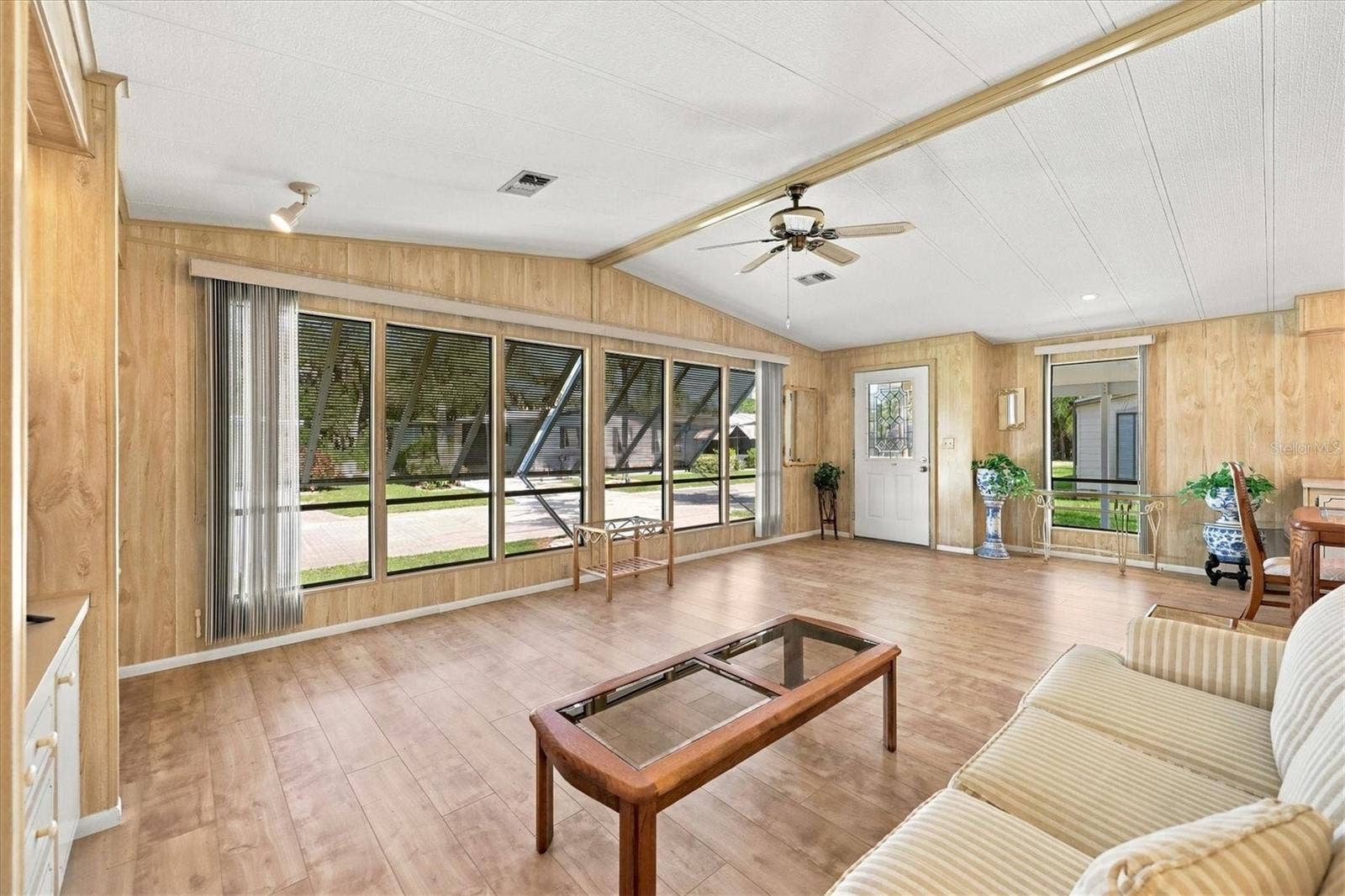 785 HEATHERCREEK COURT, Englewood, FL 34223 Wall of windows lets natural light in