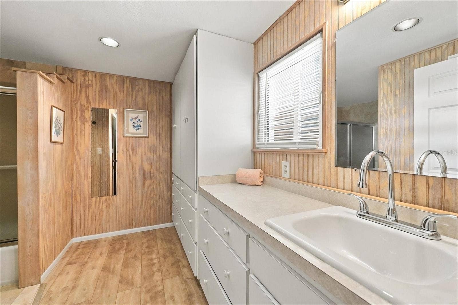 785 HEATHERCREEK COURT, Englewood, FL 34223 Ensuite bathroom - cabinets galore