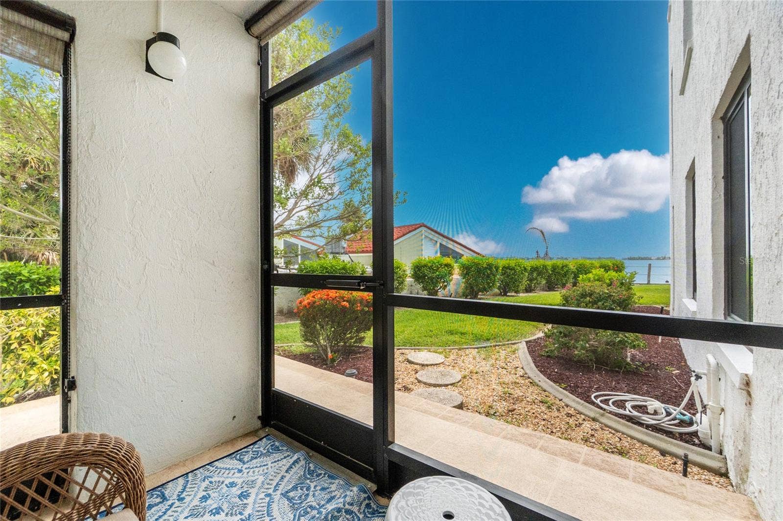 2955 N BEACH ROAD, #A411, Englewood, FL 34223 Screened Lanai with Partial Bay View