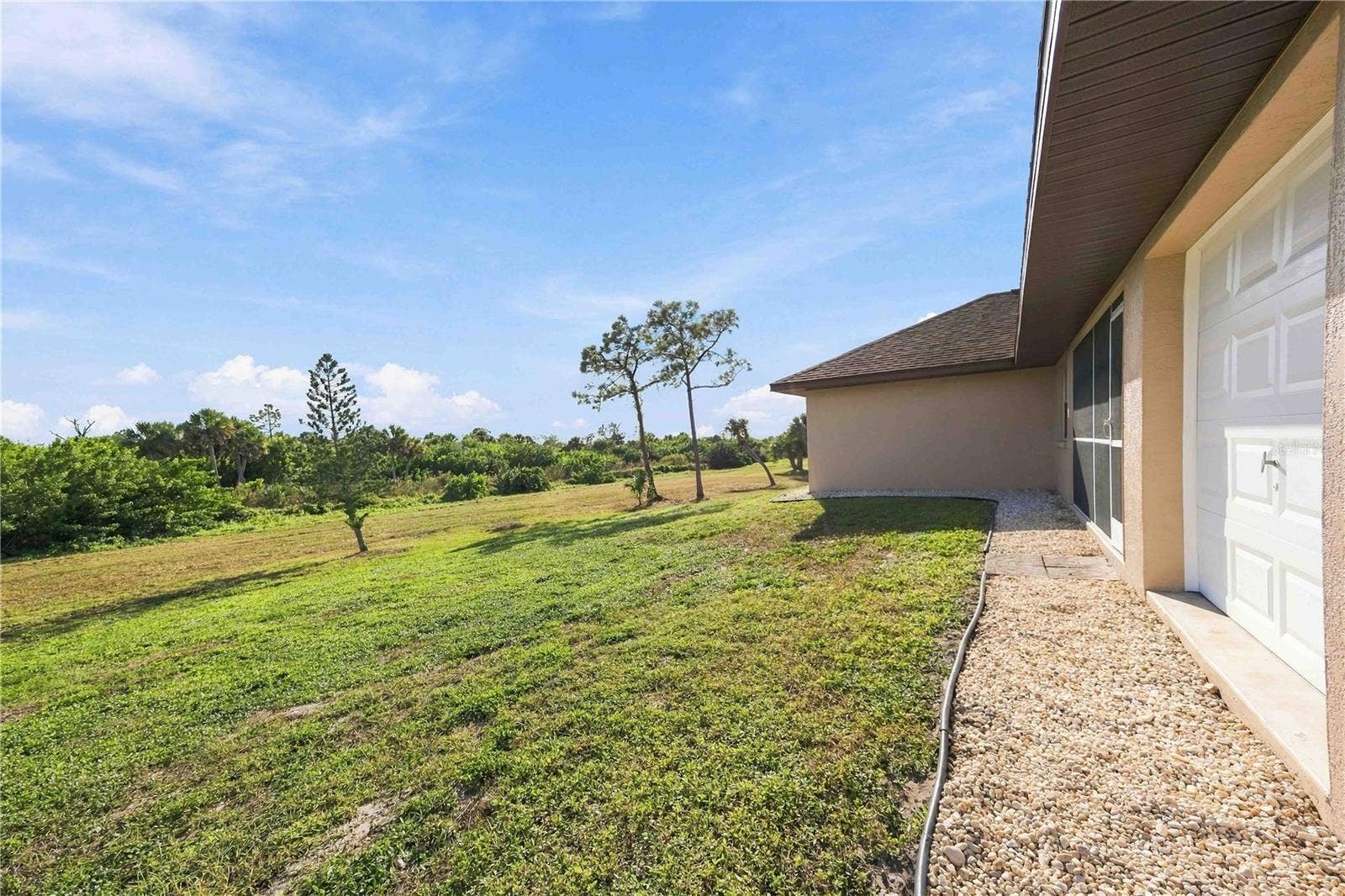 Side exterior and yard