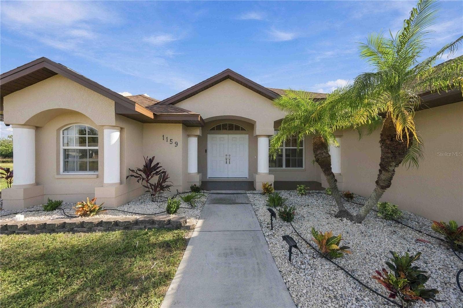 Covered front entry with landscaped walkway