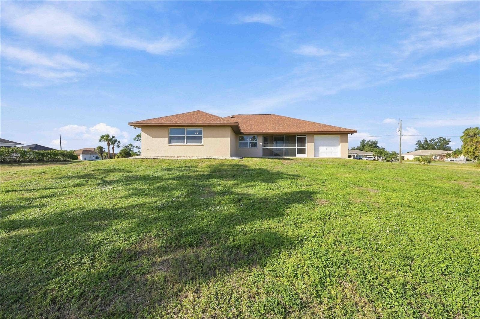 Rear exterior and expansive lot