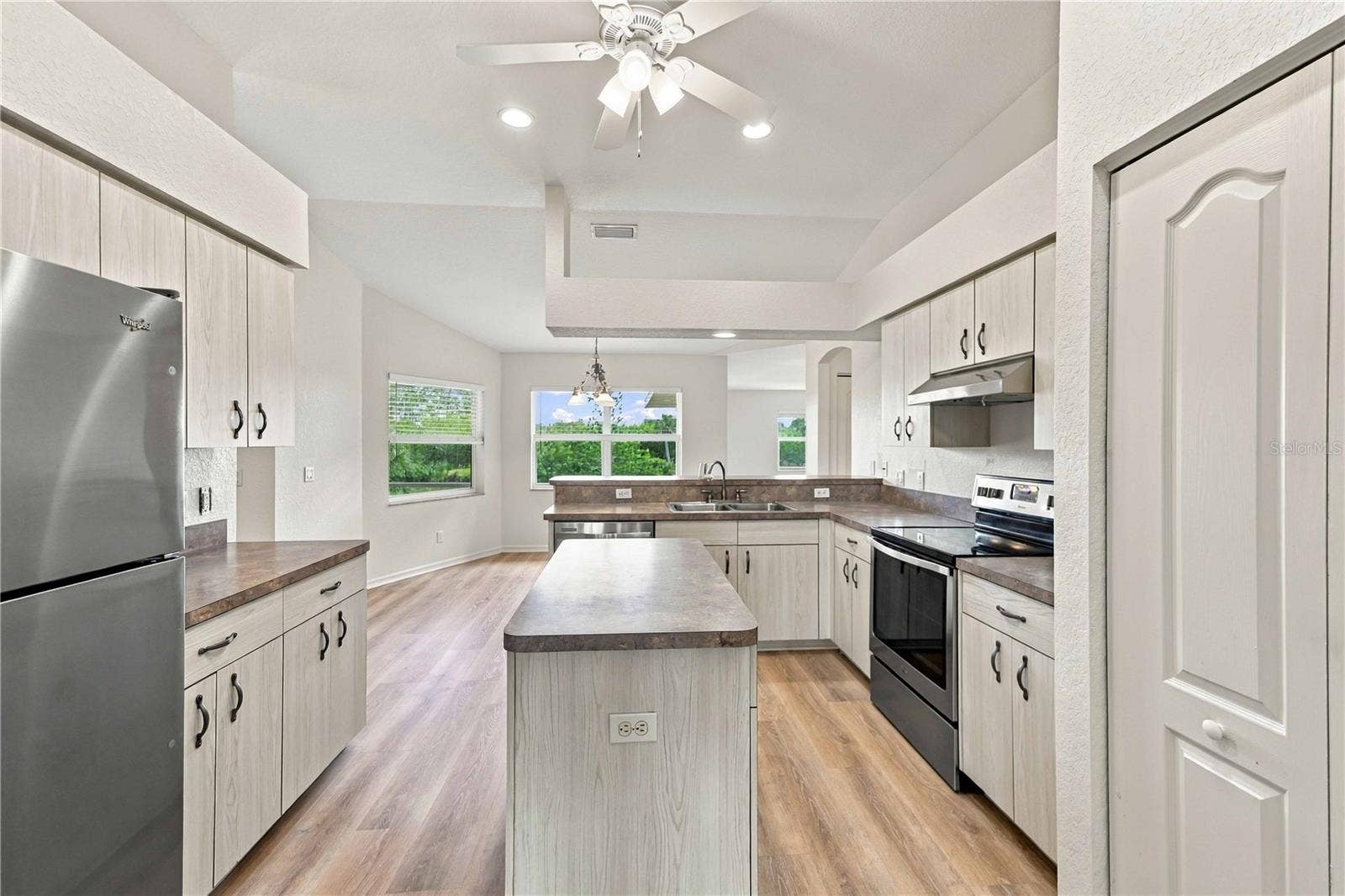 Kitchen with stainless steel appliances and center island