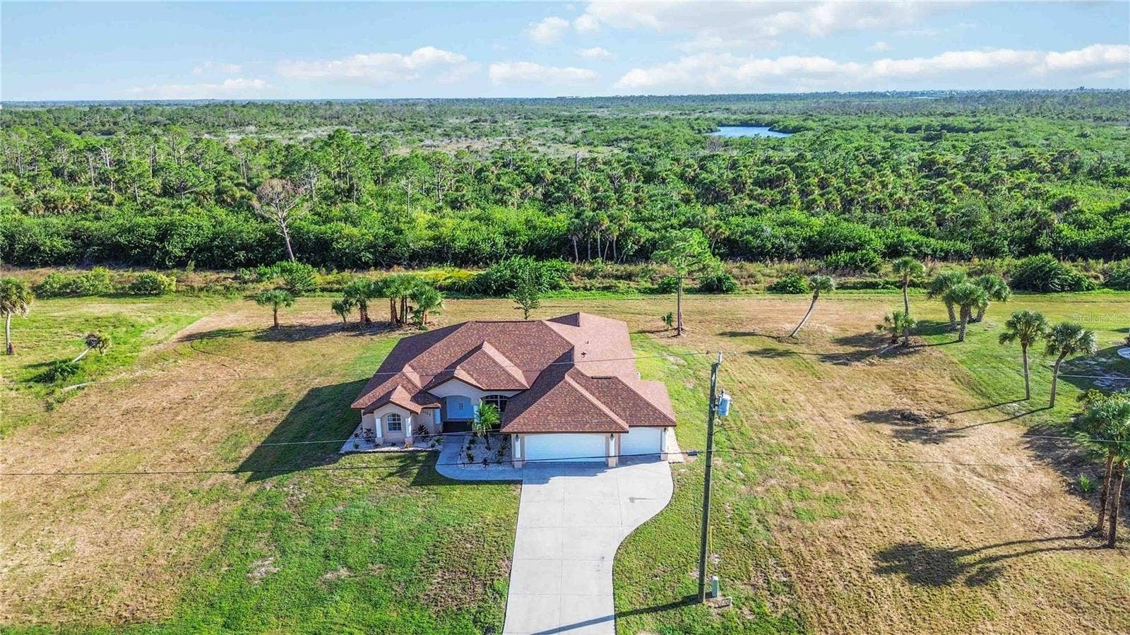 Aerial view of the home and surrounding area
