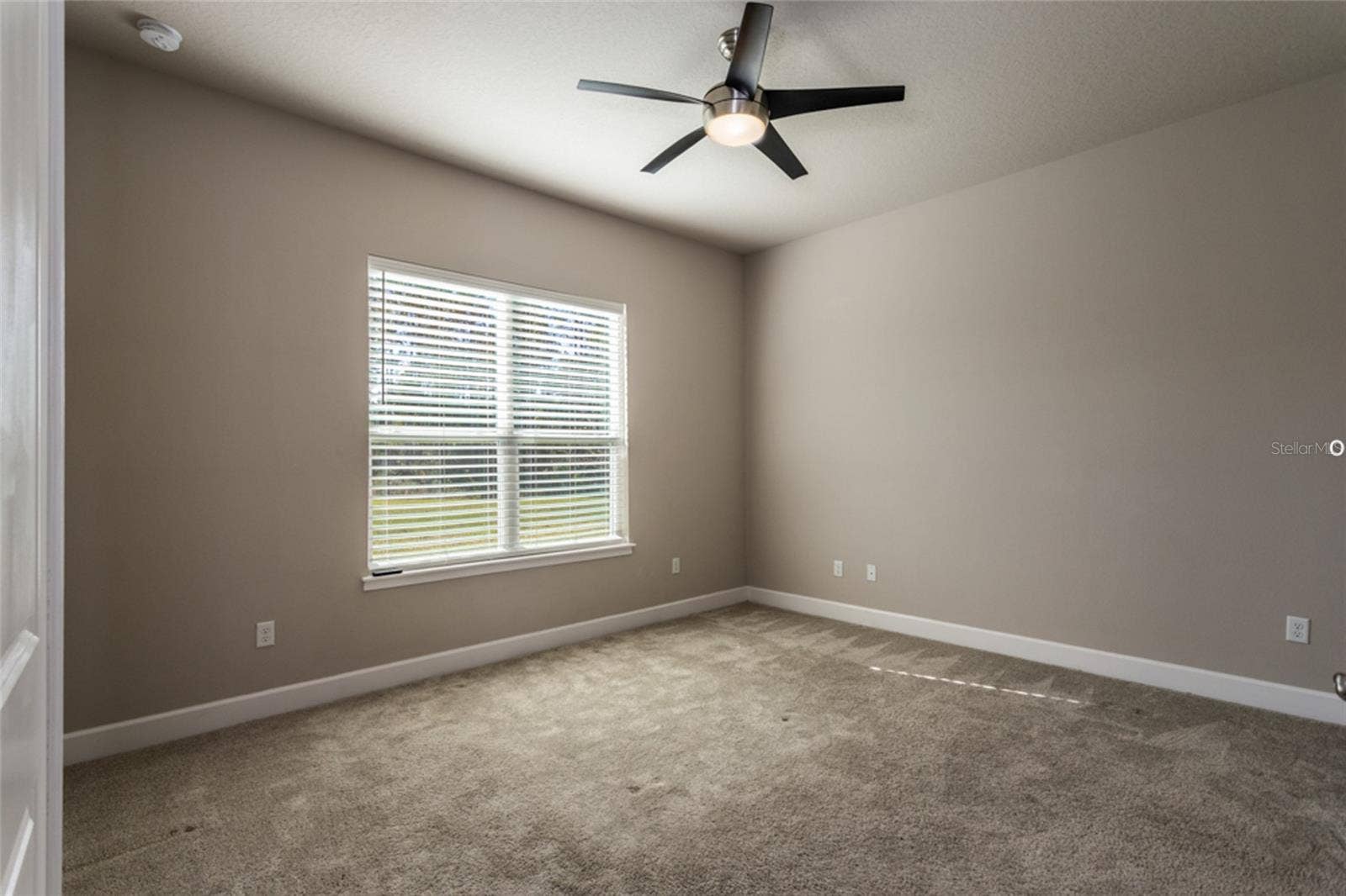 3 NEWHAVEN LANE, Ormond Beach, FL 32174 Primary bedroom -- looks out towards the wooded area