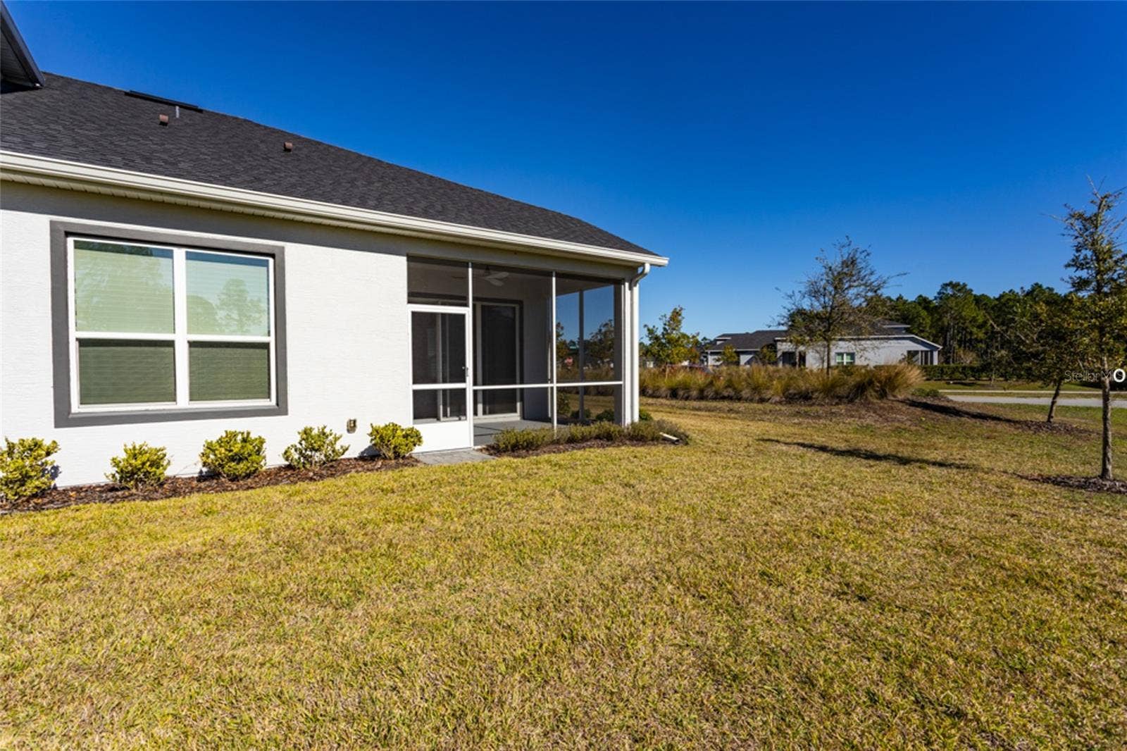 3 NEWHAVEN LANE, Ormond Beach, FL 32174 View of the back of the home. Enjoy the yard and let the HOA maintain it!