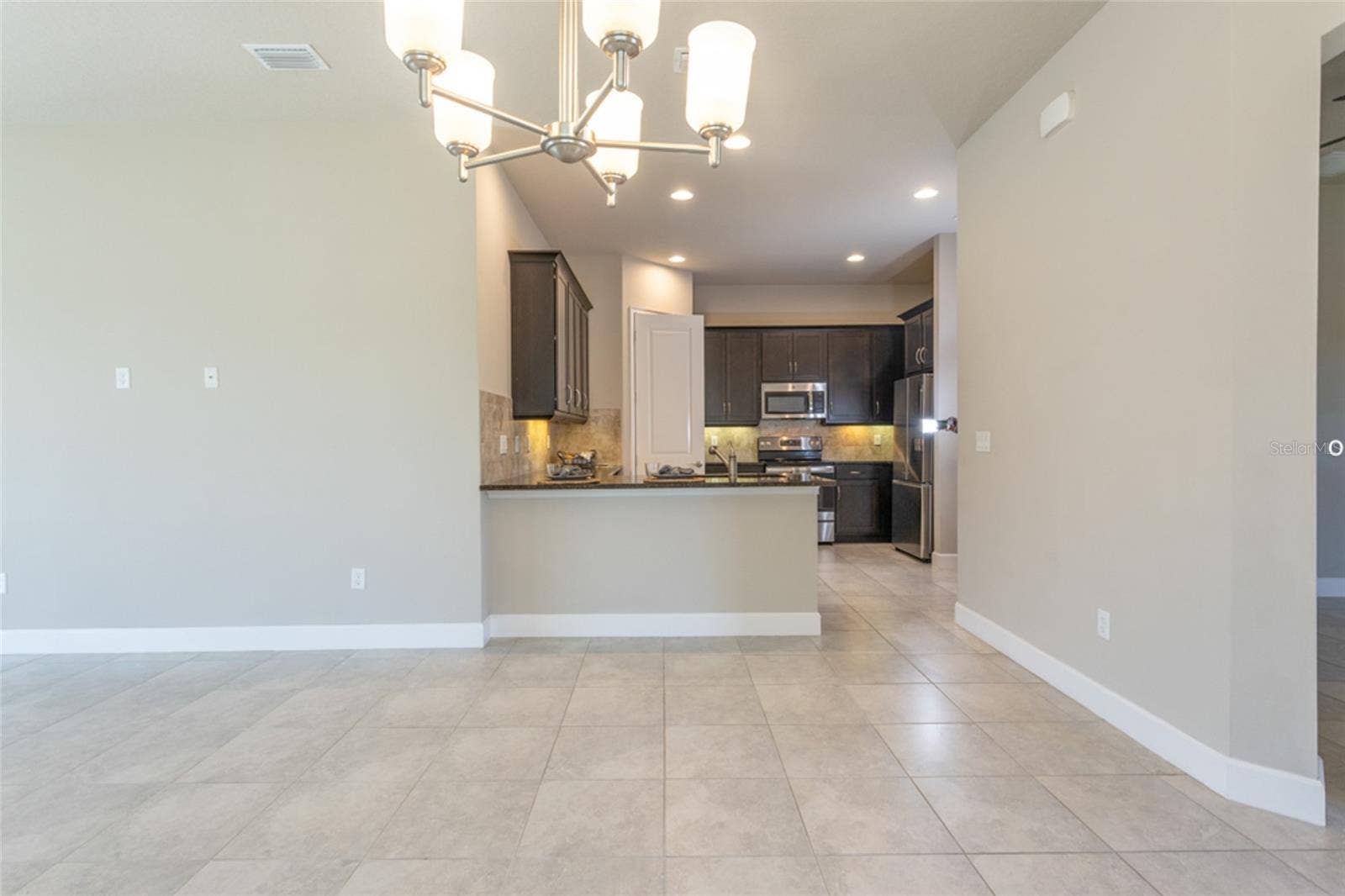 3 NEWHAVEN LANE, Ormond Beach, FL 32174 Open concept -- view from dining area into kitchen