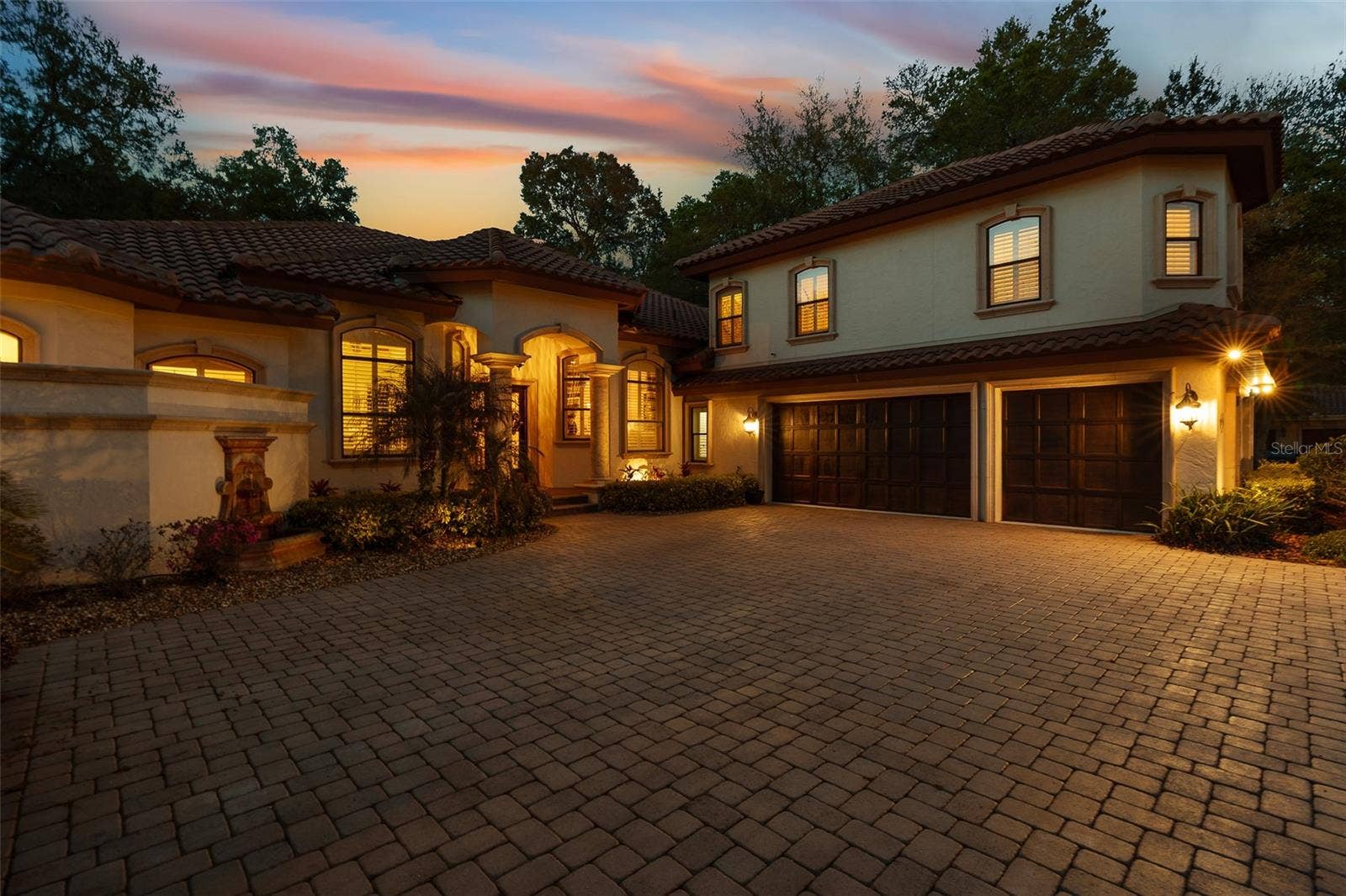 7341 BELLA FORESTA PLACE, Sanford, FL 32771 Twilight Driveway View
