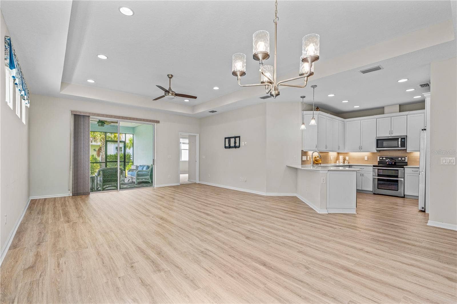 466 MARGARITAVILLE AVENUE, Daytona Beach, FL 32124 Living Area with Slider to Porch