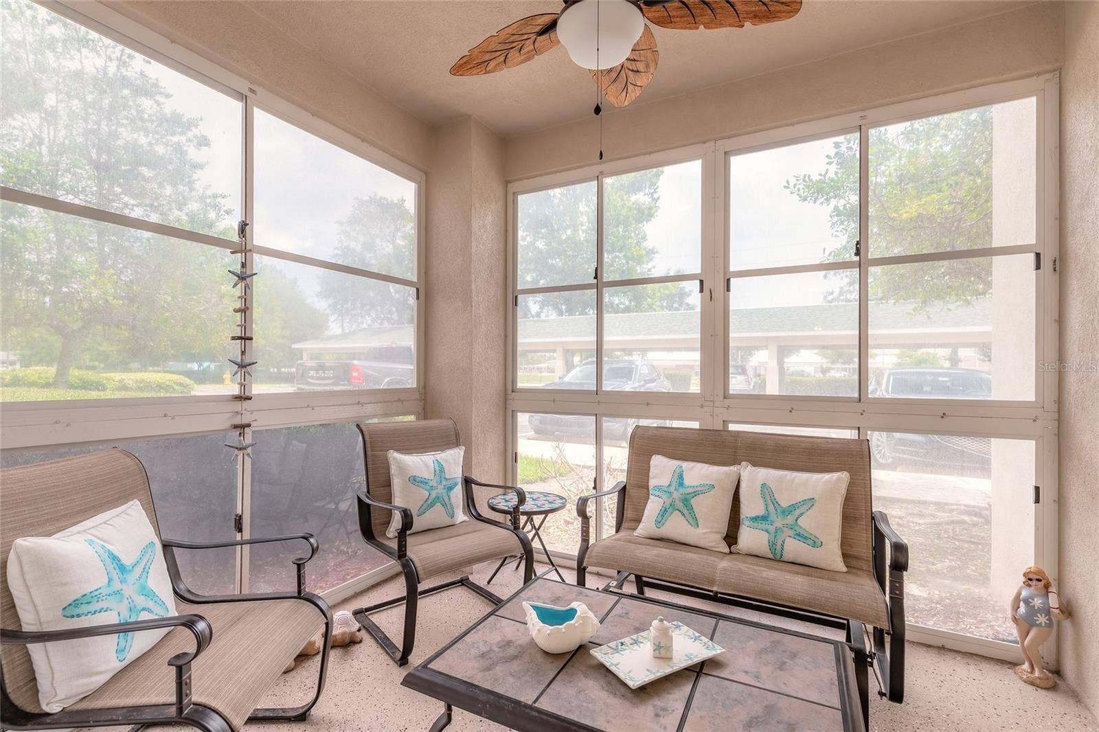 830 AIRPORT ROAD, #105, Port Orange, FL 32128 Screened coved patio that can be used as florida room