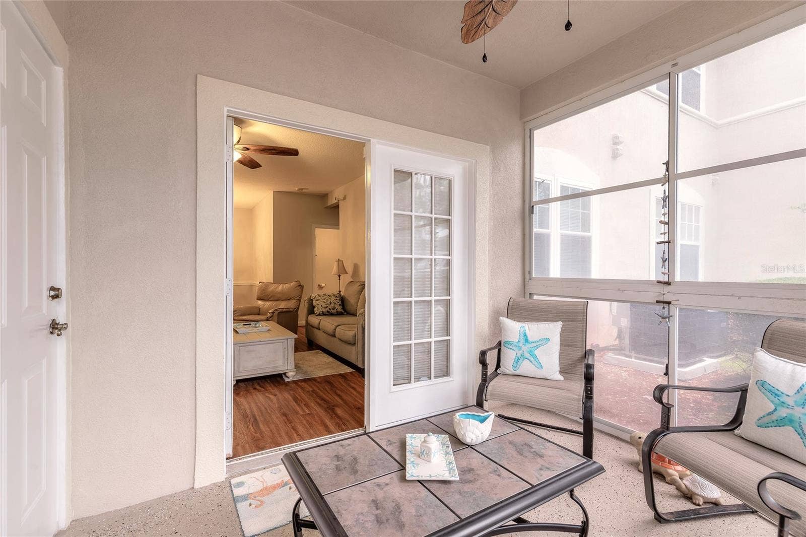 830 AIRPORT ROAD, #105, Port Orange, FL 32128 Screened coved patio that can be used as florida room