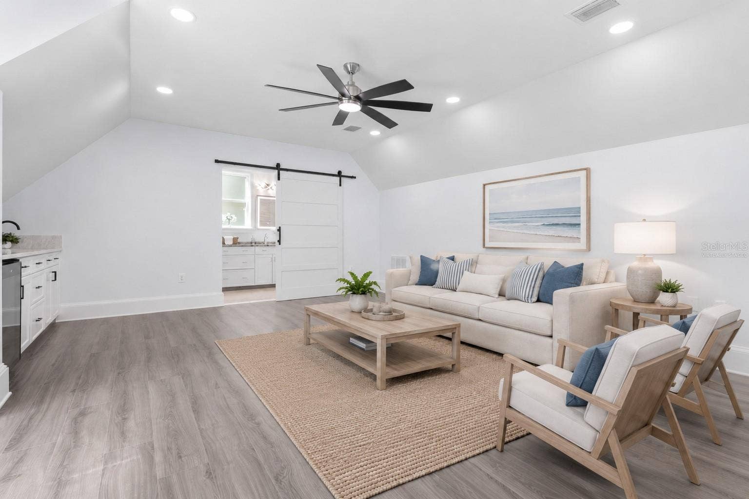 117 HERNANDEZ AVENUE, Palm Coast, FL 32137 Upstairs LR - virtually staged