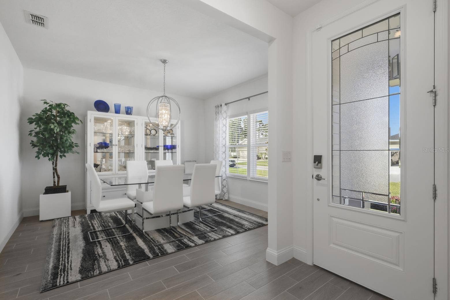 2110 RAGLAN CIRCLE, Ormond Beach, FL 32174 The gorgeous privacy glass front door greets you and allow so much light into the space.