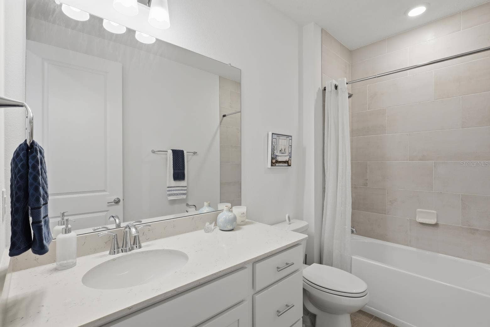 2110 RAGLAN CIRCLE, Ormond Beach, FL 32174 The second bathroom has more beautiful tile, tub/shower combination and quartz countertop.