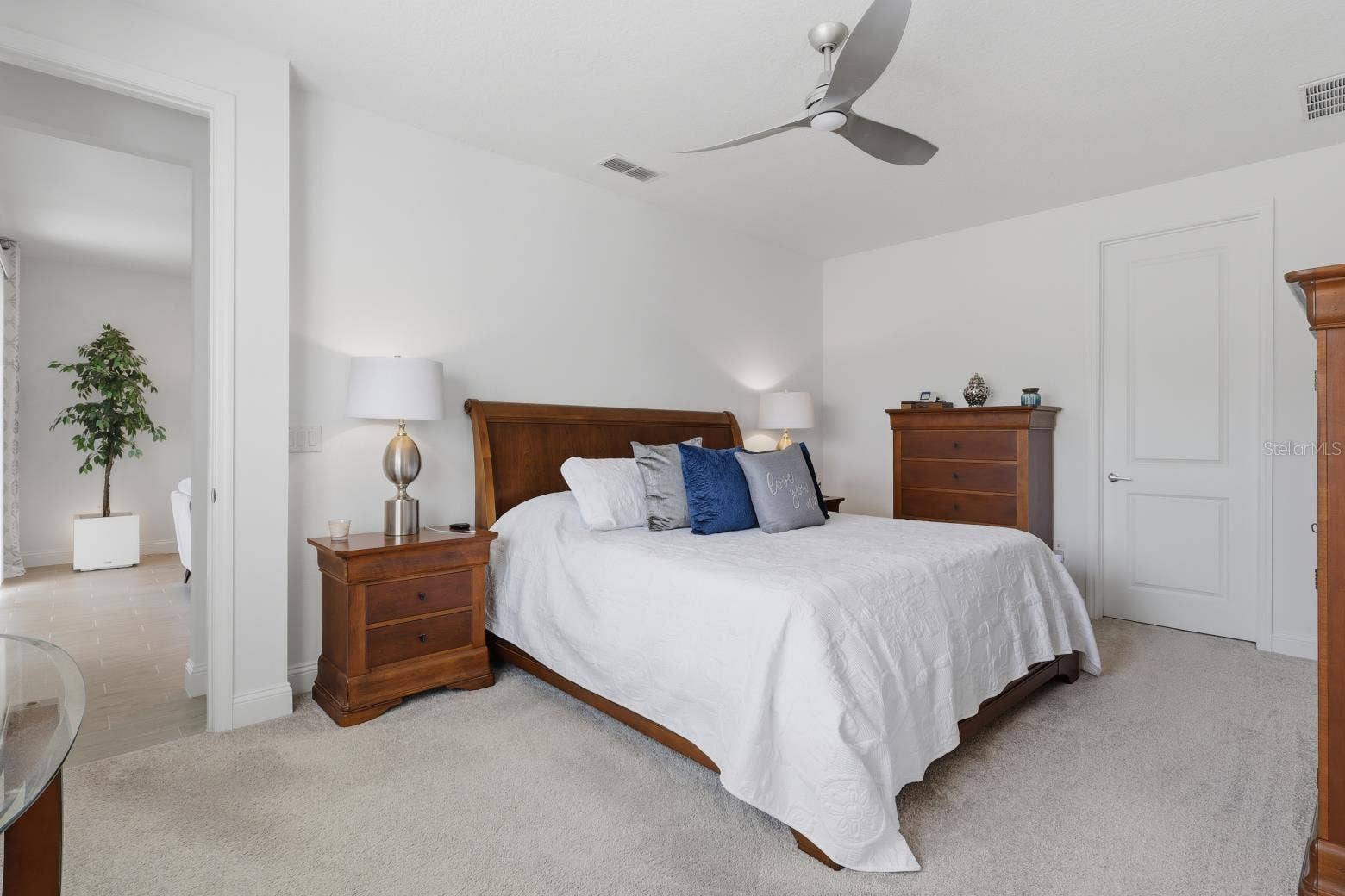 2110 RAGLAN CIRCLE, Ormond Beach, FL 32174 The spacious primary bedroom can house large sets of furniture. Their is also a large walk-in closet in the room.