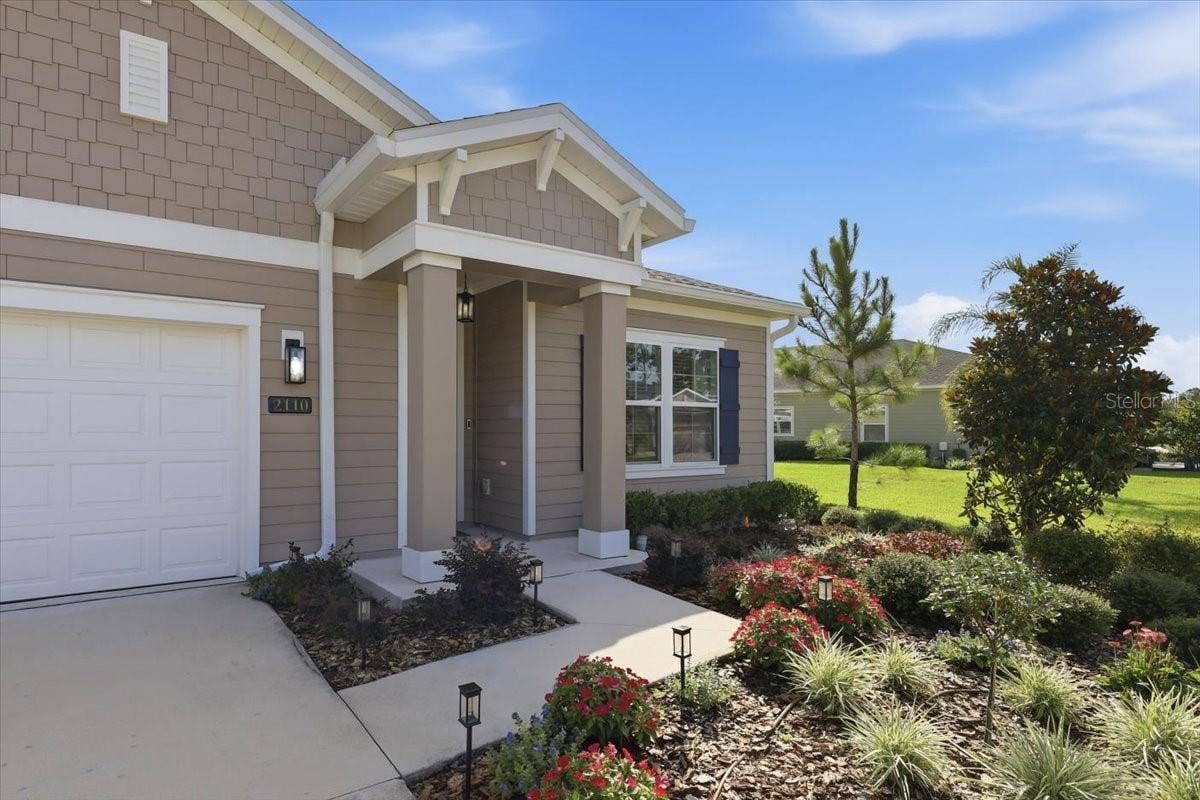 2110 RAGLAN CIRCLE, Ormond Beach, FL 32174 As you walk up the front walkway you can see how meticulously maintained this home is.