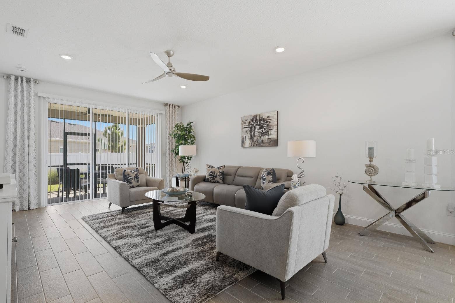 2110 RAGLAN CIRCLE, Ormond Beach, FL 32174 This space is a wonderful family gathering space. Easily can hold a sectional sofa if needed. Gray plank style tile is just gorgeous in this house.