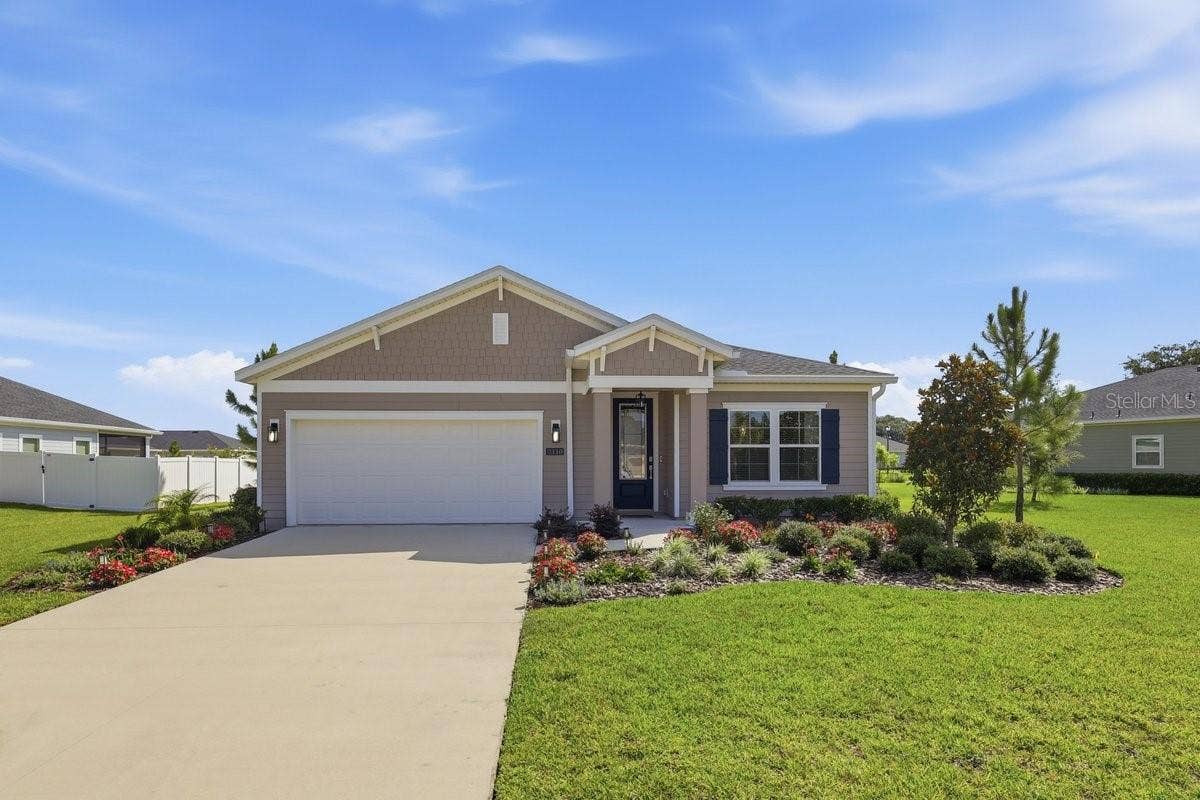 2110 RAGLAN CIRCLE, Ormond Beach, FL 32174 This home will WOW you with the gorgeous landscaping and meticulously maintained yard.