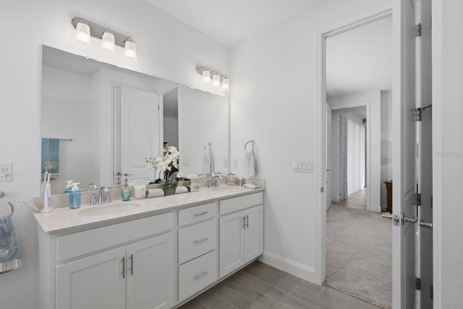 2110 RAGLAN CIRCLE, Ormond Beach, FL 32174 Double Sink Vanity with drawers for storage in the primary bathroom.
