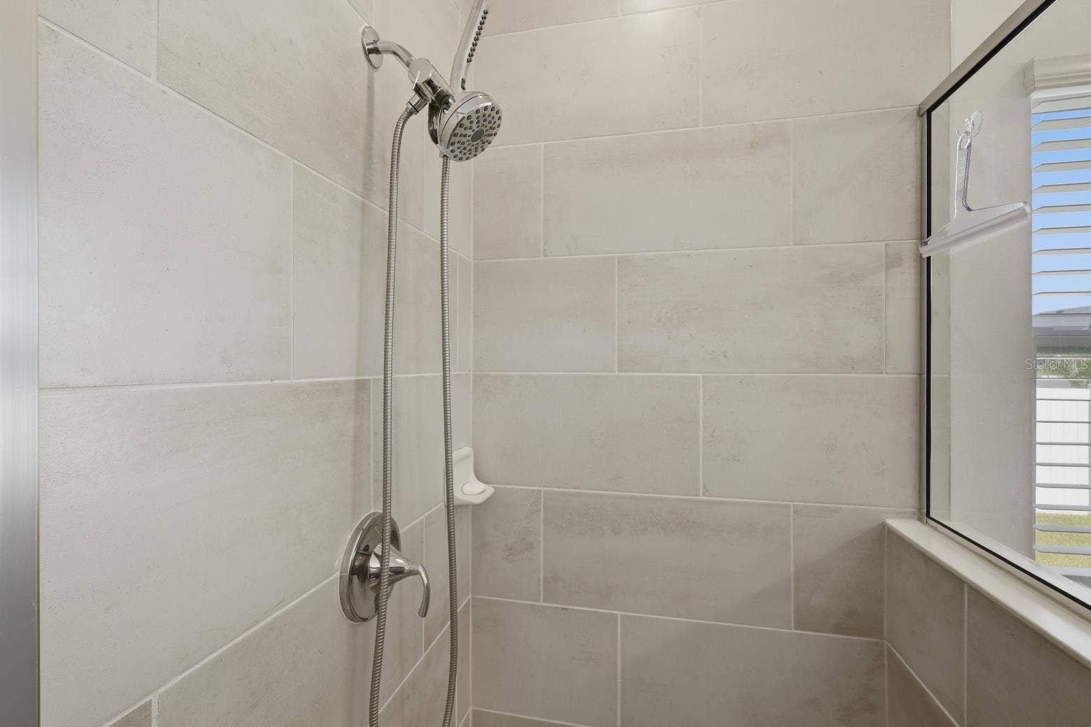 2110 RAGLAN CIRCLE, Ormond Beach, FL 32174 Shower Stall has fabulous large plank tiles.