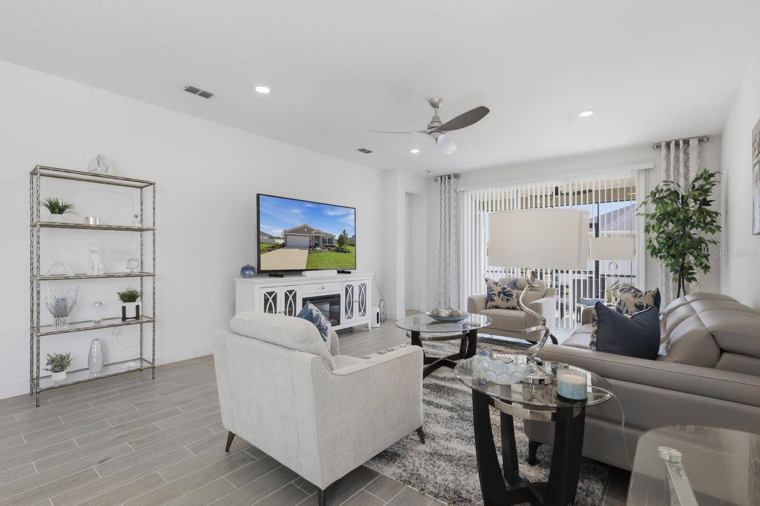 2110 RAGLAN CIRCLE, Ormond Beach, FL 32174 Featuring a custom ceiling fan and blinds over the rear sliding glass door for privacy.
