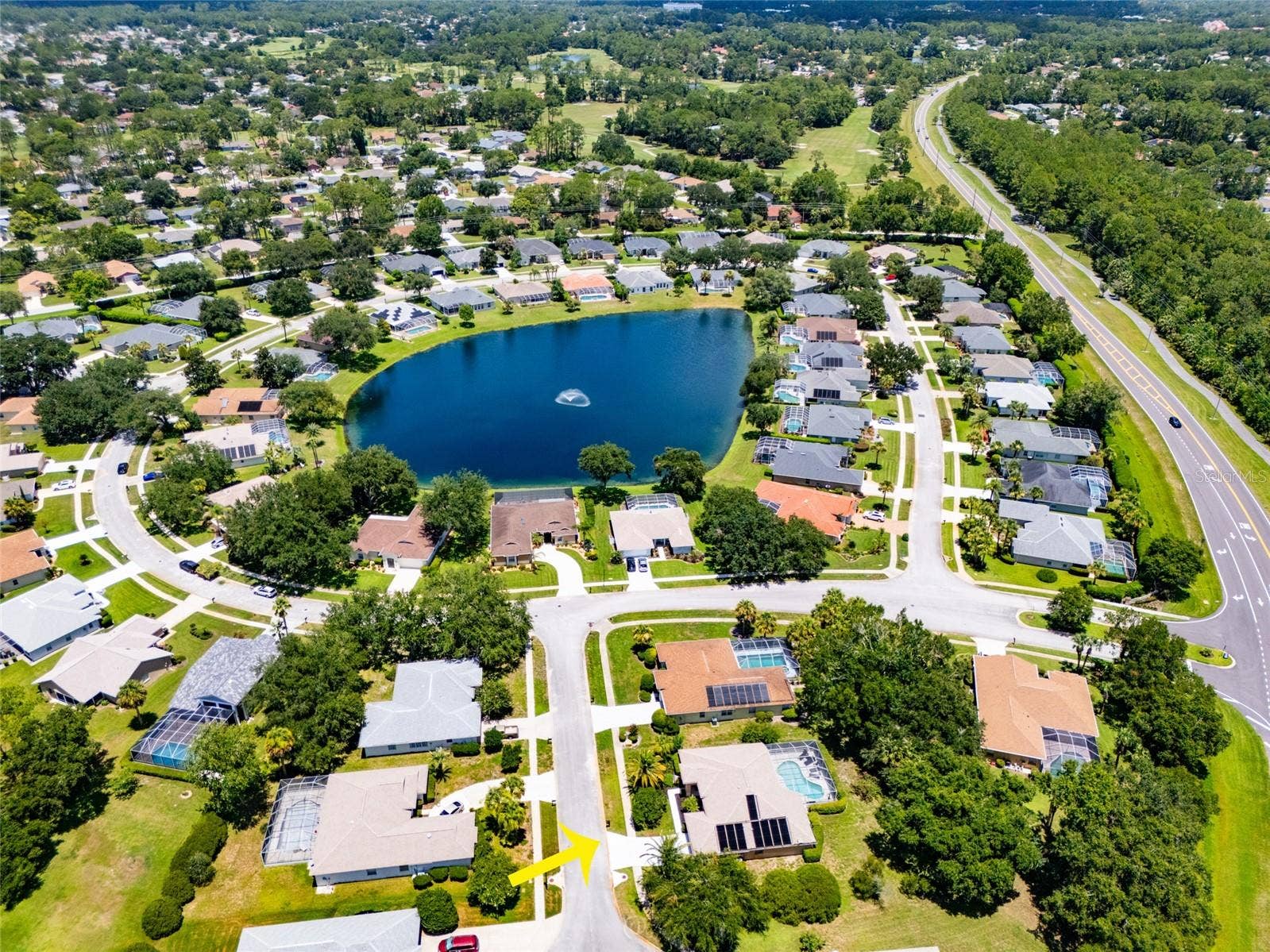 5 FAIRFAX COURT, Palm Coast, FL 32164 Aerial view of community with lake