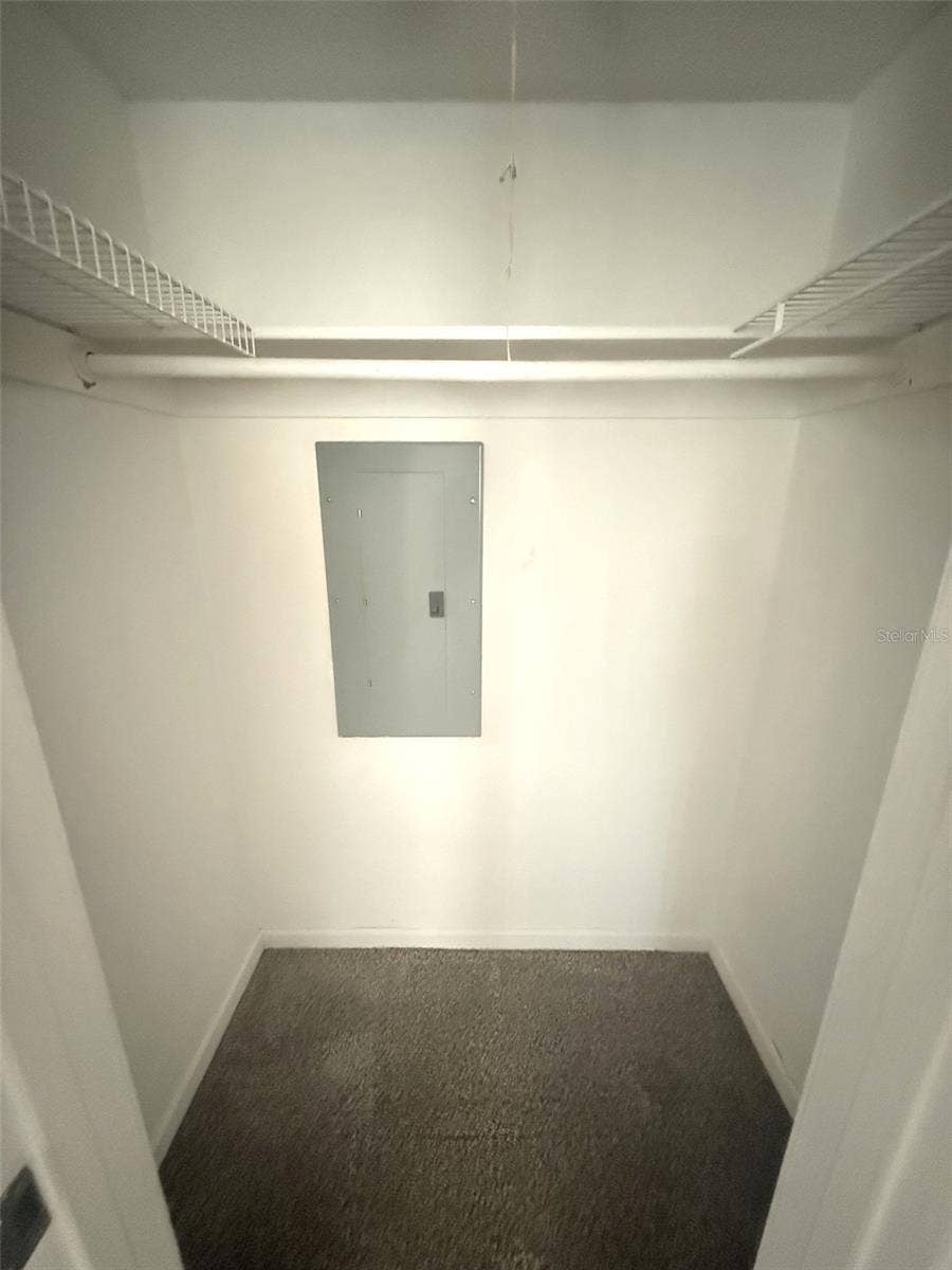UNSTAGED GUEST WALK IN CLOSET