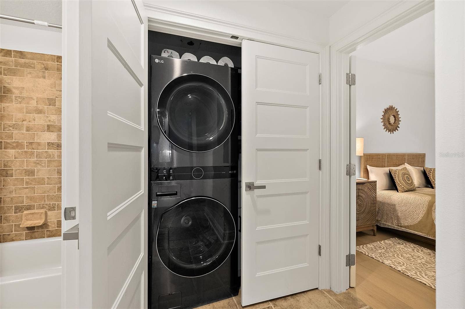 Laundry closet with shelves and electrial outlets