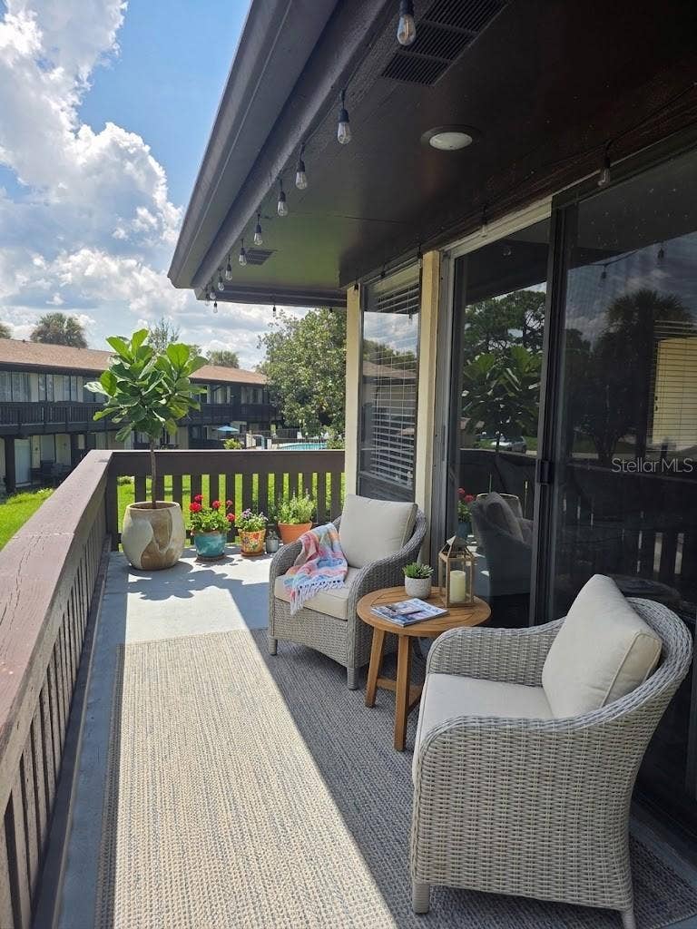 60 CLUB HOUSE DRIVE, #208, Palm Coast, FL 32137 Virtual staged balcony