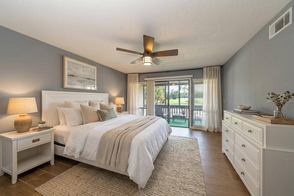 60 CLUB HOUSE DRIVE, #208, Palm Coast, FL 32137 Virtually staged Primary Suite