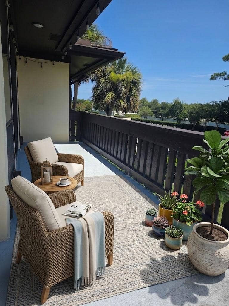 60 CLUB HOUSE DRIVE, #208, Palm Coast, FL 32137 virtually staged balcony