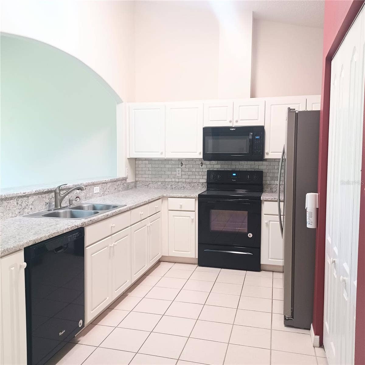 Kitchen pantry on right side of frig
