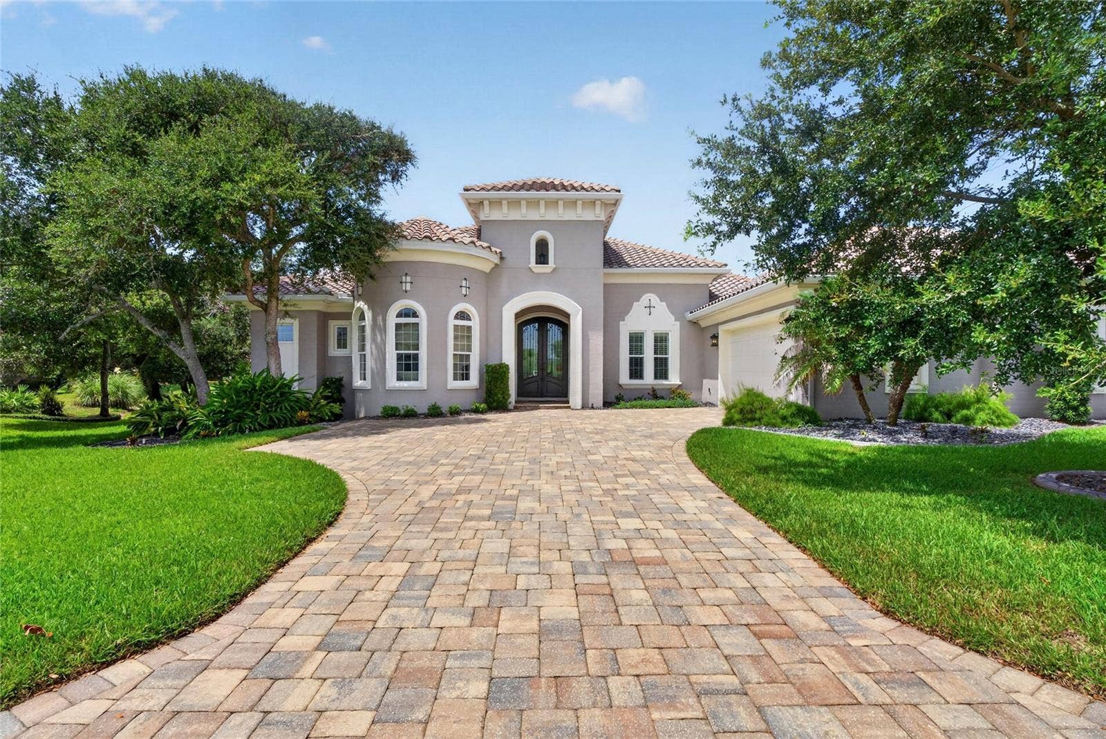 55 OCEAN OAKS LANE, Palm Coast, FL 32137 A custom coastal residence, thoughtfully designed for indoor-outdoor living!