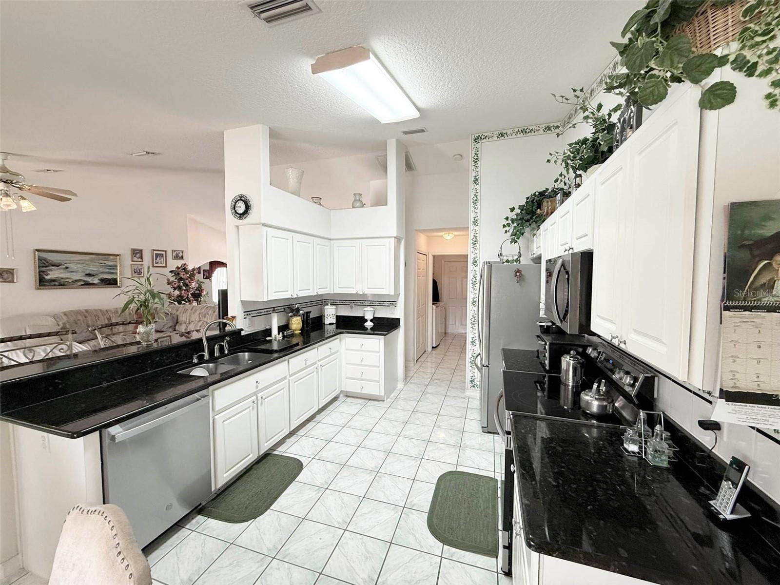 22 COLORADO DRIVE, Palm Coast, FL 32137 Kitchen with granite countertops & stainless steel appliances