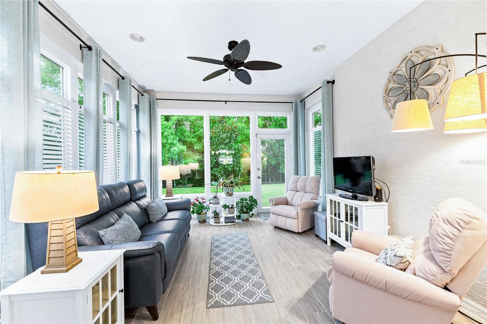 Your new favorite room! This heated and air-conditioned Florida room offers comfortable, year-round living space for relaxing, entertaining or enjoying the sunshinewithout the heat