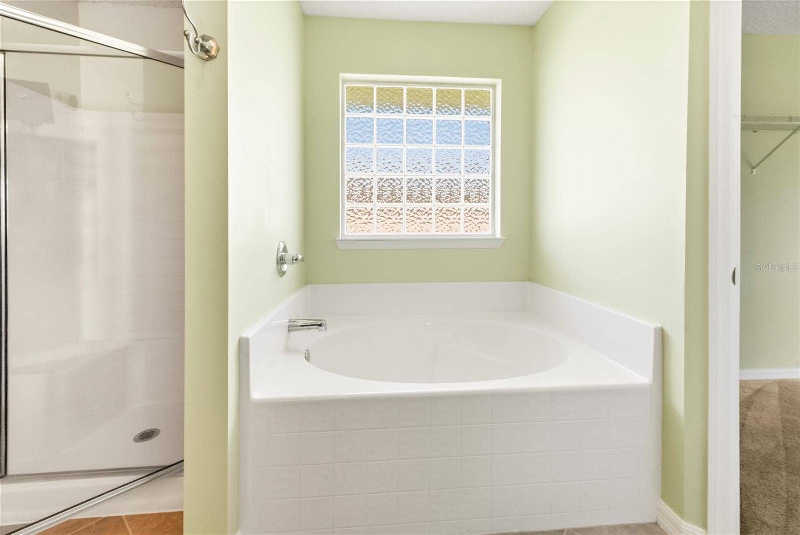 38 PRINCESS ROSE DRIVE, Palm Coast, FL 32164 Primary Bathroom Garden Tub and Shower