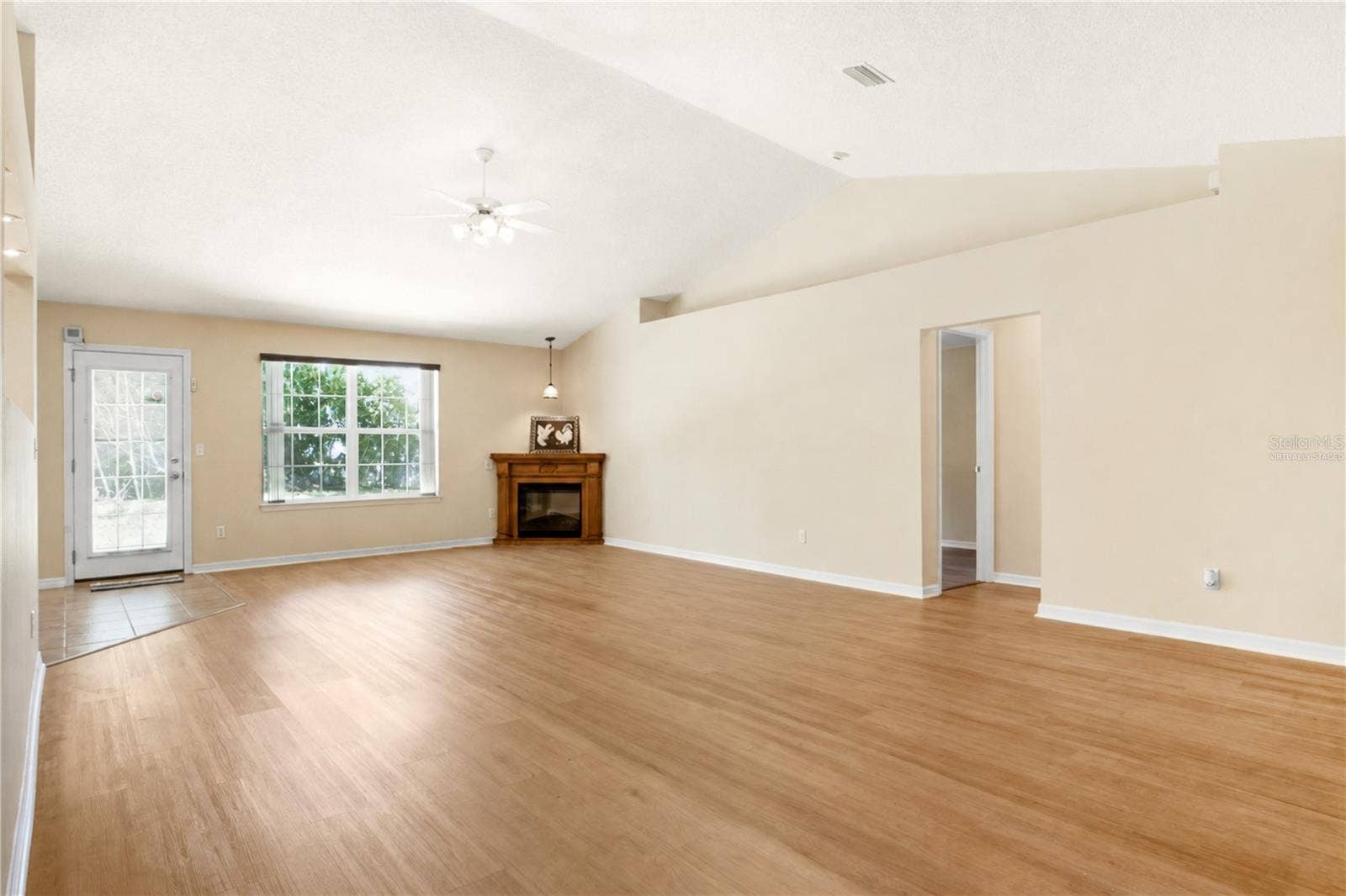 38 PRINCESS ROSE DRIVE, Palm Coast, FL 32164 Virtually staged: Great Room without pool table and light from the Front Entrance