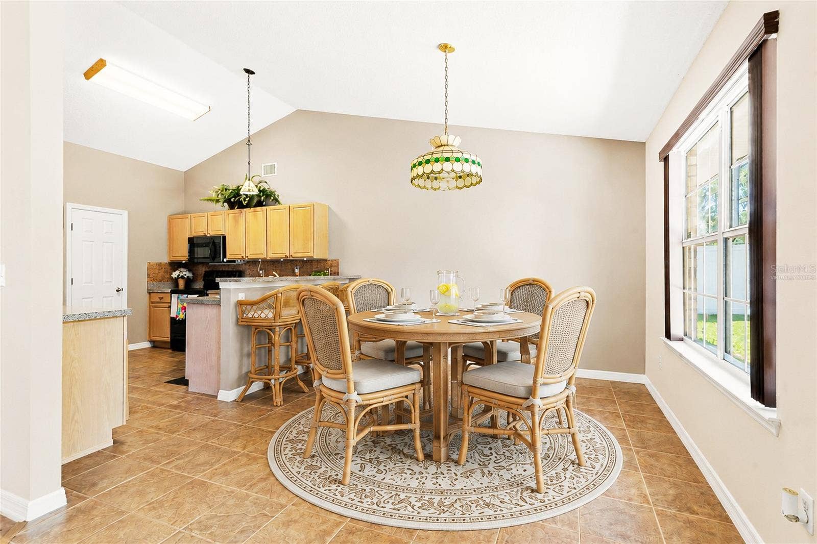 38 PRINCESS ROSE DRIVE, Palm Coast, FL 32164 Virtually Staged Breakfast Nook with a Roun d Table Option