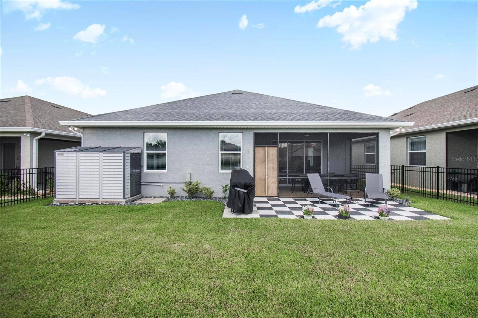 7 TIDEWAY TRAIL, Palm Coast, FL 32137 backyard view of house and shed
