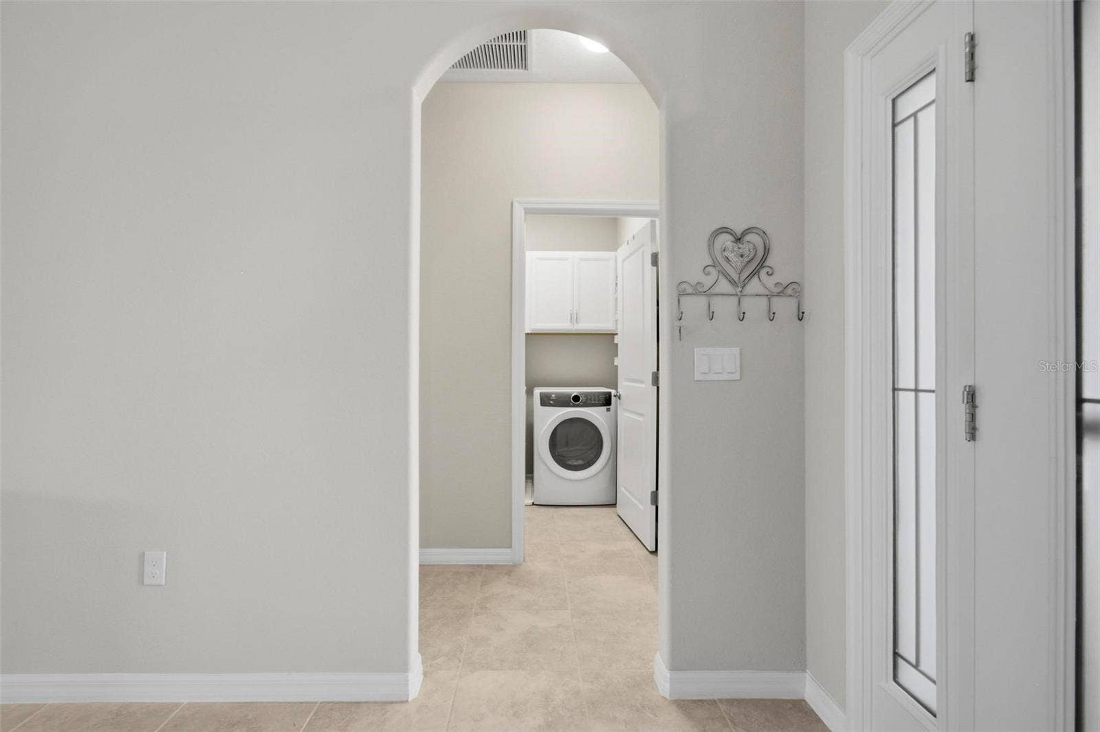 7 TIDEWAY TRAIL, Palm Coast, FL 32137 view of hallway to laundry room