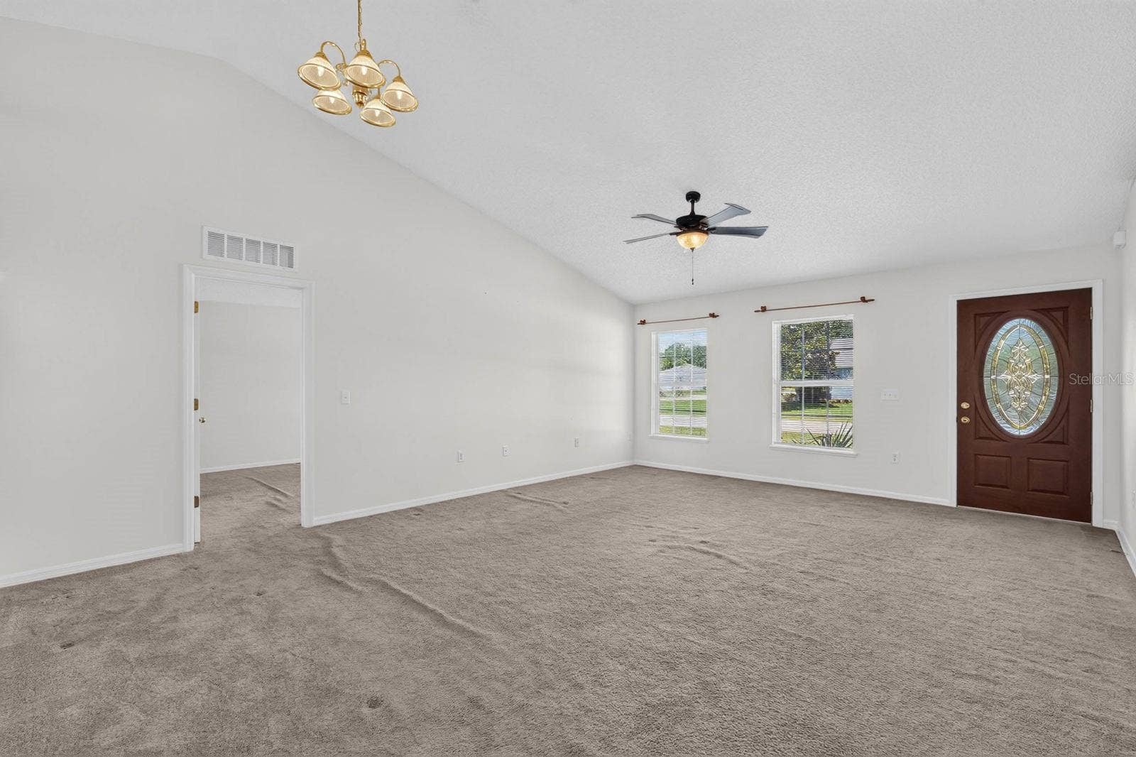99 PICKERING DRIVE, Palm Coast, FL 32164 Front living room/dining room looking towards entrance