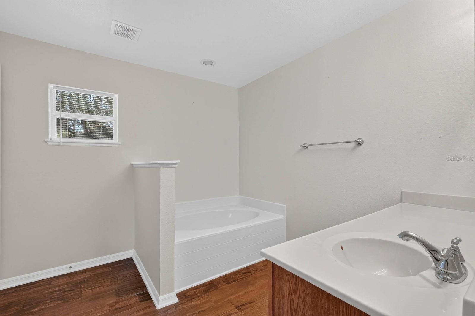 99 PICKERING DRIVE, Palm Coast, FL 32164 ensuite bathroom features soaking tub and separate shower