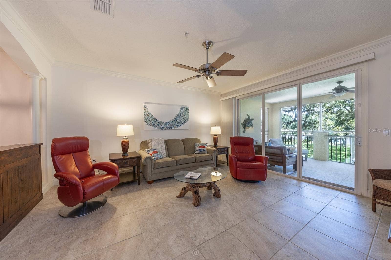 115 RIVERVIEW BEND S, #2123, Palm Coast, FL 32137 TITLED LIVING AREA WITH SLIDERS THAT OPEN TO SCREENED PATIO