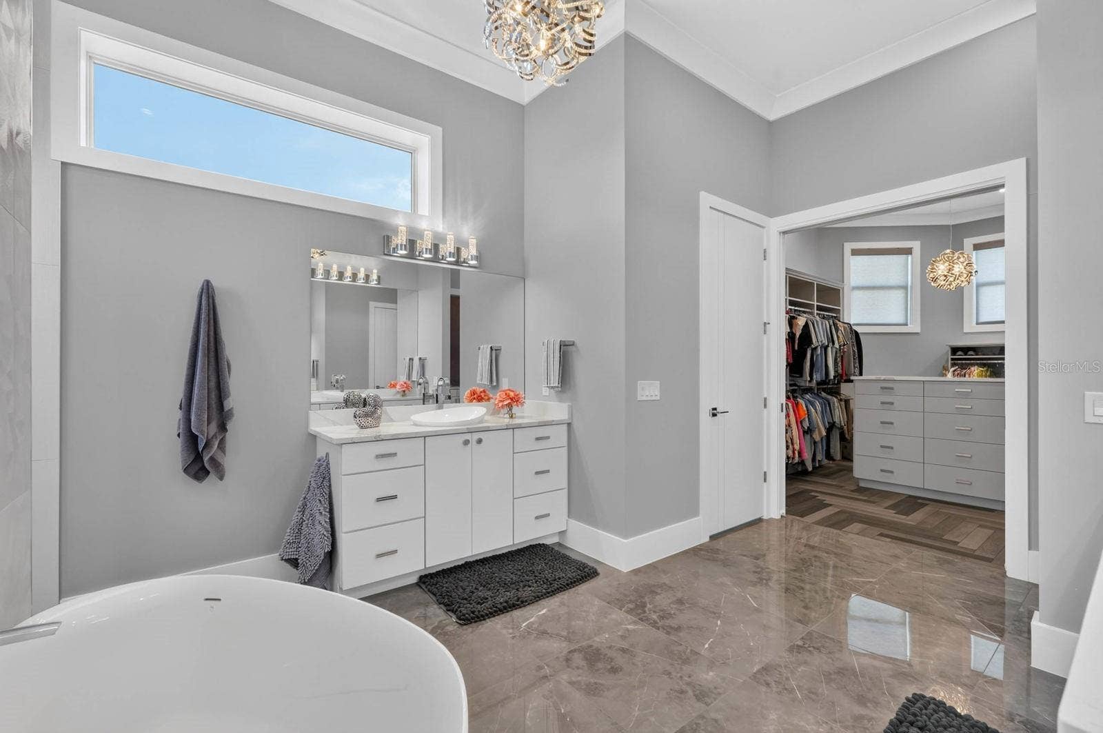 304 YACHT HARBOR DRIVE, Palm Coast, FL 32137 Separate vanities and a beautifully appointed walk-in dressing room all part of the private owners level.