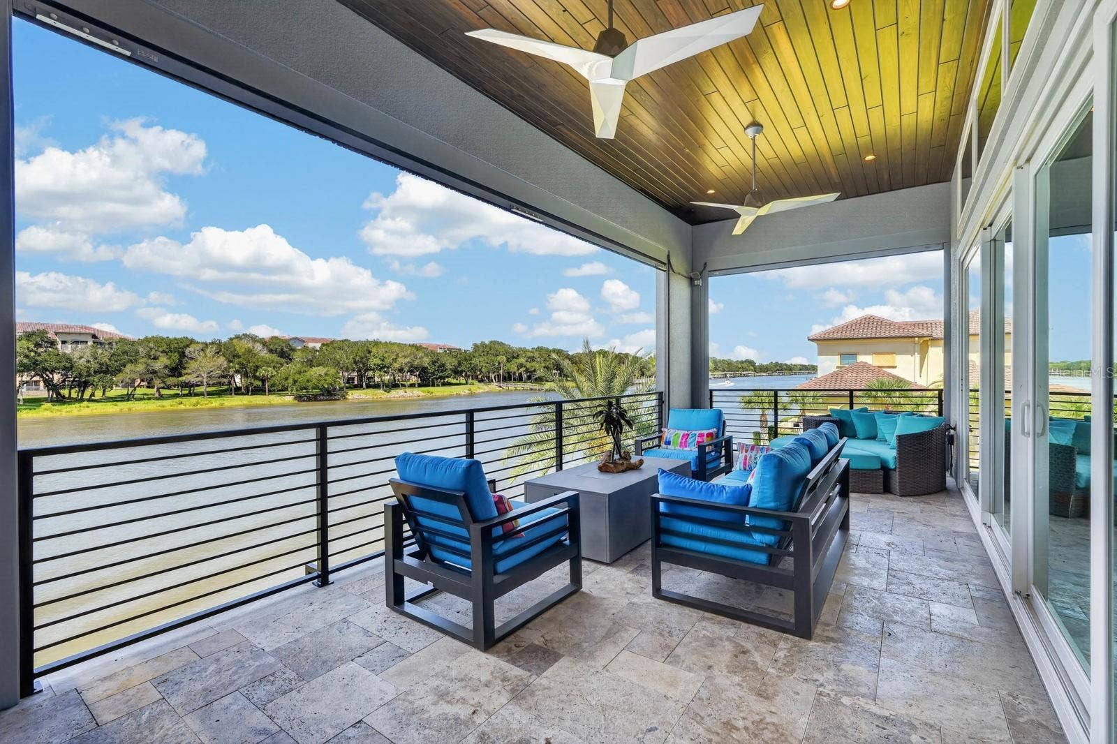 304 YACHT HARBOR DRIVE, Palm Coast, FL 32137 NDOORS OR OUT THIS FLOOR LIVES BIG.Walls of glass carry the living space right onto the covered balcony.
