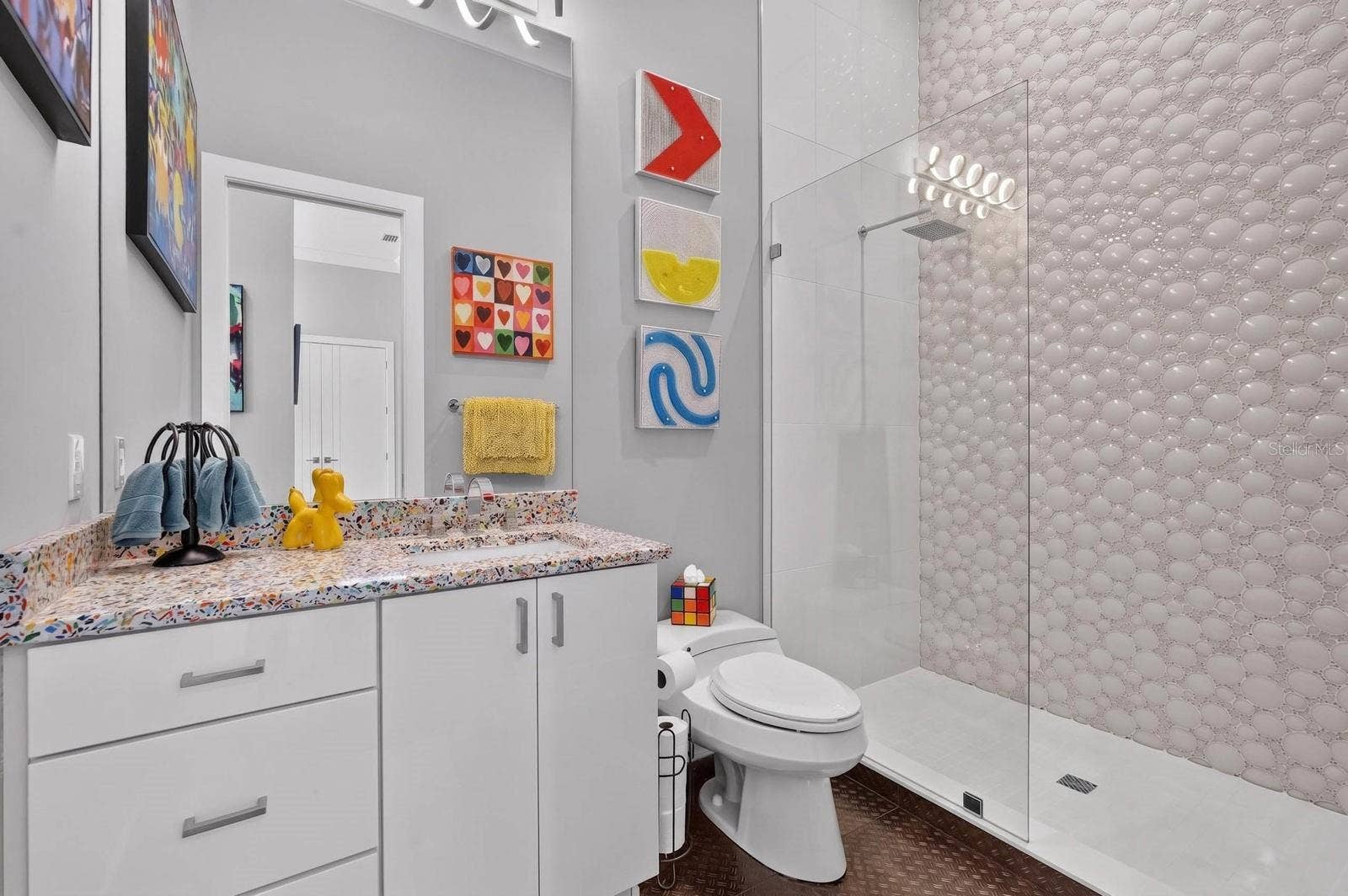 304 YACHT HARBOR DRIVE, Palm Coast, FL 32137 Can we just talk about this shower tile? Such a fun detail and another example of how this home refuses to be ordinary.