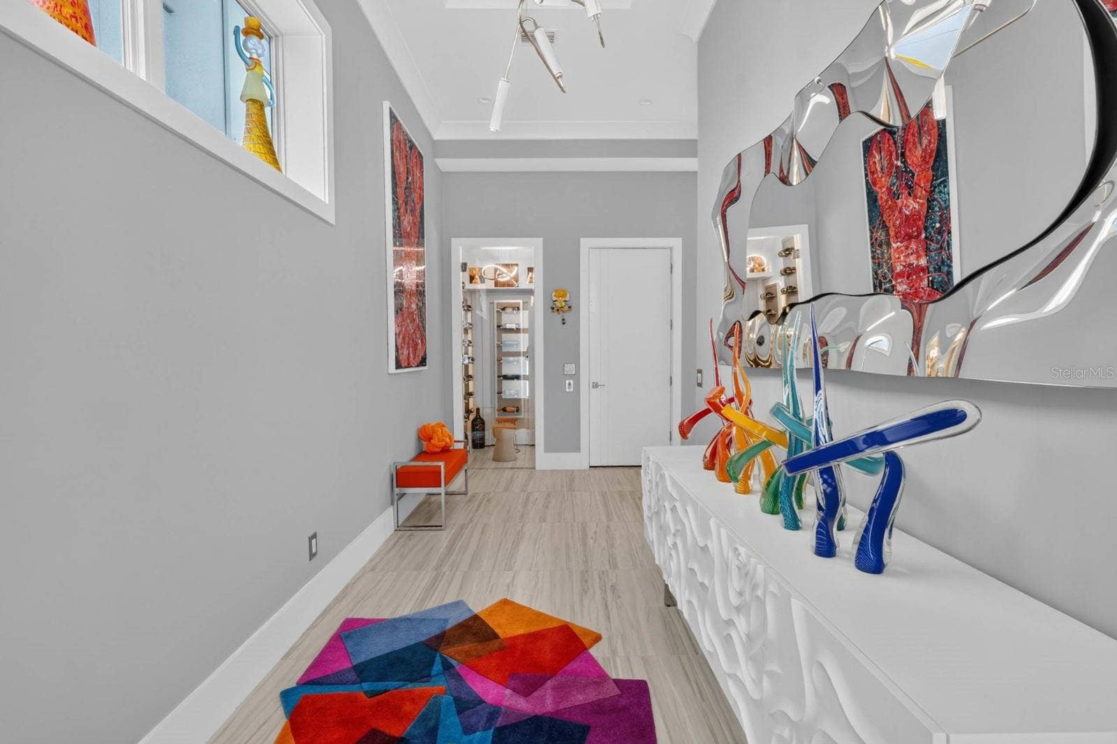 304 YACHT HARBOR DRIVE, Palm Coast, FL 32137 A gallery-like arrival. Soaring ceilings, statement lighting and custom finishes lead you toward one of the homes unexpected details...the dedicated wine room.